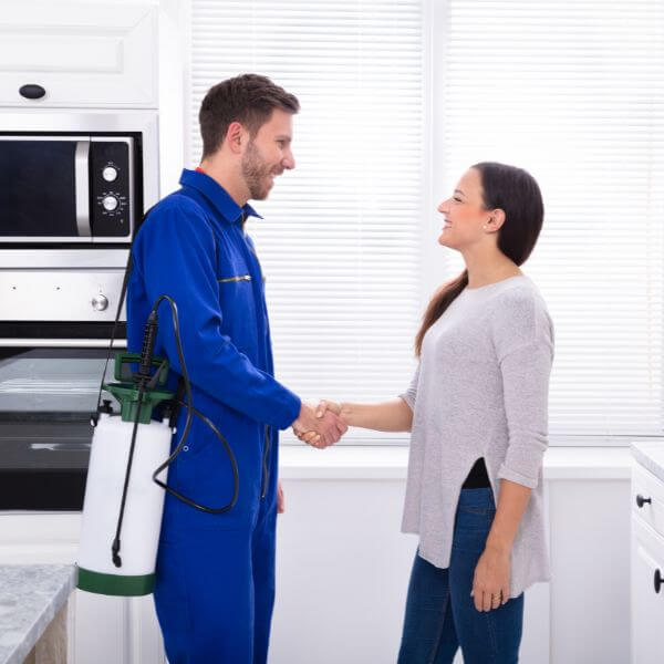 True Blue Pest Control delivering pest control service in Winston Hills, technician greeting client after treatment.
